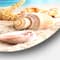 Designart - Starfish and Seashells on Beach' Seashore Photo Metal Circle Wall Art